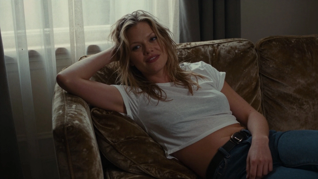 Kate Moss in a white crop top, messy hair, lounging on velvet couch, 1996 The Face cover.